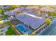 Aerial view of an expansive property with a sparkling pool, lush lawns, and meticulously designed landscaping at 9117 Hickam Ave, Las Vegas, NV 89129