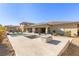 Stunning backyard featuring a pool, spa, fire pit and outdoor kitchen at 9117 Hickam Ave, Las Vegas, NV 89129