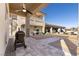 A beautiful outdoor space complete with desert landscaping, a covered patio, and an outdoor grill area for entertaining at 9117 Hickam Ave, Las Vegas, NV 89129