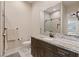 Elegant bathroom with granite countertops, modern fixtures, and frameless glass shower at 9117 Hickam Ave, Las Vegas, NV 89129