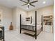 Comfortable bedroom with stylish decor, ceiling fan, and ample closet space at 9117 Hickam Ave, Las Vegas, NV 89129