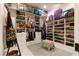 Organized walk-in closet with custom shelving and storage solutions for clothing, shoes, and accessories at 9117 Hickam Ave, Las Vegas, NV 89129