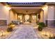 Inviting front porch with comfortable seating, stone accents, and a paved walkway at 9117 Hickam Ave, Las Vegas, NV 89129