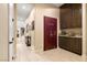 Hallway featuring custom Fort Knox door with cabinetry and granite countertop at 9117 Hickam Ave, Las Vegas, NV 89129
