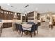 Spacious kitchen with custom cabinetry, stainless steel appliances, and a large island with seating at 9117 Hickam Ave, Las Vegas, NV 89129