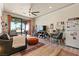 Open floor plan with a combined living area and kitchen and access to the patio at 9117 Hickam Ave, Las Vegas, NV 89129