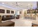Spacious living room with a wet bar, comfortable seating, and entertainment area at 9117 Hickam Ave, Las Vegas, NV 89129