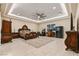 Expansive primary bedroom with tray ceilings, unique furniture, and great natural light, providing a luxurious retreat at 9117 Hickam Ave, Las Vegas, NV 89129