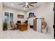 Spacious office featuring a ceiling fan, a large window, and custom nautical décor, complete with ample storage at 9117 Hickam Ave, Las Vegas, NV 89129