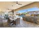 Outdoor dining area featuring a built-in BBQ and view of the pool at 9117 Hickam Ave, Las Vegas, NV 89129