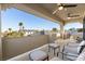 Outdoor patio featuring a seating area under a covered space with views of the neighborhood at 9117 Hickam Ave, Las Vegas, NV 89129