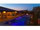 Inviting pool and spa area with a cozy fire pit, perfect for outdoor entertaining and relaxation at 9117 Hickam Ave, Las Vegas, NV 89129