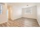 Bedroom with wood floors and a window with white shutters at 10235 Tresor Ct, Las Vegas, NV 89135