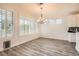 Dining room with a chandelier and shuttered windows offering natural light at 10235 Tresor Ct, Las Vegas, NV 89135