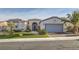 Charming single-story home features a desert landscaped front yard and attached two car garage at 10235 Tresor Ct, Las Vegas, NV 89135