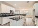 Bright kitchen with white cabinets, stainless steel appliances, and granite countertops at 10235 Tresor Ct, Las Vegas, NV 89135