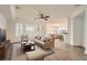 Open-concept living room boasts plenty of natural light and wood-look flooring at 10235 Tresor Ct, Las Vegas, NV 89135