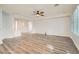 Bright living room with wood flooring and white walls at 10235 Tresor Ct, Las Vegas, NV 89135