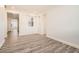 Bright room with wood floors and a window with white shutters at 10235 Tresor Ct, Las Vegas, NV 89135