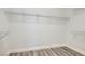Bright walk-in closet featuring wood-look flooring and wire shelving at 10235 Tresor Ct, Las Vegas, NV 89135