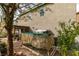 A partial view of the home's backyard featuring an outdoor kitchen, garden, and privacy at 10450 Kepler Cascades St, Las Vegas, NV 89141
