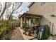 Enclosed backyard features a pergola, built-in counters, and potential for outdoor entertaining at 10450 Kepler Cascades St, Las Vegas, NV 89141