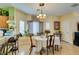 Dining area boasting tile floors, a breakfast bar, and lots of natural lighting at 10450 Kepler Cascades St, Las Vegas, NV 89141