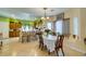 Bright dining area flowing into the kitchen featuring tile floors and natural light at 10450 Kepler Cascades St, Las Vegas, NV 89141
