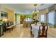 Bright dining area connected to kitchen with tiled flooring and lots of natural light at 10450 Kepler Cascades St, Las Vegas, NV 89141