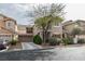 Charming two-story home with a landscaped front yard and a two-car garage at 10450 Kepler Cascades St, Las Vegas, NV 89141