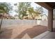 Unfinished backyard featuring concrete block wall at 10643 Petricola St # 103, Las Vegas, NV 89183