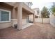 Cozy backyard with neutral tones and small patio, perfect for outdoor relaxation at 10643 Petricola St # 103, Las Vegas, NV 89183