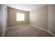Spacious bedroom with a window and wall to wall carpet at 10643 Petricola St # 103, Las Vegas, NV 89183