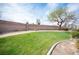 Expansive community green space with well-maintained lawn and walking path at 10643 Petricola St # 103, Las Vegas, NV 89183