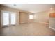 Bright and airy living room boasting neutral walls, tile floors, and direct access to the outdoor area at 10643 Petricola St # 103, Las Vegas, NV 89183