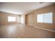 Open-concept living room with ample natural light and tile flooring, creating a welcoming and spacious environment at 10643 Petricola St # 103, Las Vegas, NV 89183
