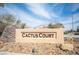 Stone community sign reads Cactus Court under a bright sky, inviting residents and guests at 10643 Petricola St # 103, Las Vegas, NV 89183
