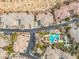 Birds-eye view of the community, showcasing a luxurious pool, spa, and well-maintained landscaping at 10730 Amber Ridge Dr # 205, Las Vegas, NV 89144