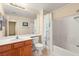 Bathroom with a vanity sink, toilet, and a shower-tub combination with a floral shower curtain at 10730 Amber Ridge Dr # 205, Las Vegas, NV 89144