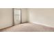 Bedroom with neutral walls, carpet, and a bright window with blinds and curtains at 10730 Amber Ridge Dr # 205, Las Vegas, NV 89144