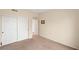 Bedroom with neutral walls, carpet and a double door closet at 10730 Amber Ridge Dr # 205, Las Vegas, NV 89144