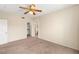 Bedroom featuring plush carpeting, a ceiling fan, and walk-in closet at 10730 Amber Ridge Dr # 205, Las Vegas, NV 89144