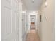 Hallway featuring tile flooring and neutral wall colors, leading to other areas of the home at 10730 Amber Ridge Dr # 205, Las Vegas, NV 89144