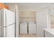 Convenient laundry closet with side by side washer and dryer and extra storage space at 10730 Amber Ridge Dr # 205, Las Vegas, NV 89144