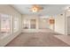 Bright living room with carpet flooring and large windows provides ample natural light at 10730 Amber Ridge Dr # 205, Las Vegas, NV 89144