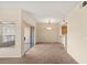 Open-concept living space with carpet, sliding glass doors, and dining area at 10730 Amber Ridge Dr # 205, Las Vegas, NV 89144