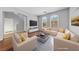 Bright living room with hardwood floors, neutral walls, and large windows at 11060 Magenta Crest Ct, Henderson, NV 89052