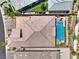 Drone shot of a home featuring a private pool and manicured landscaping, providing an inviting outdoor space at 11185 Black Fire Opal Dr, Las Vegas, NV 89138