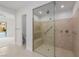 A modern tiled shower with bench is featured in this well lit bathroom at 11185 Black Fire Opal Dr, Las Vegas, NV 89138