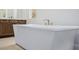 Bright bathroom featuring a freestanding tub with modern faucets at 11185 Black Fire Opal Dr, Las Vegas, NV 89138
